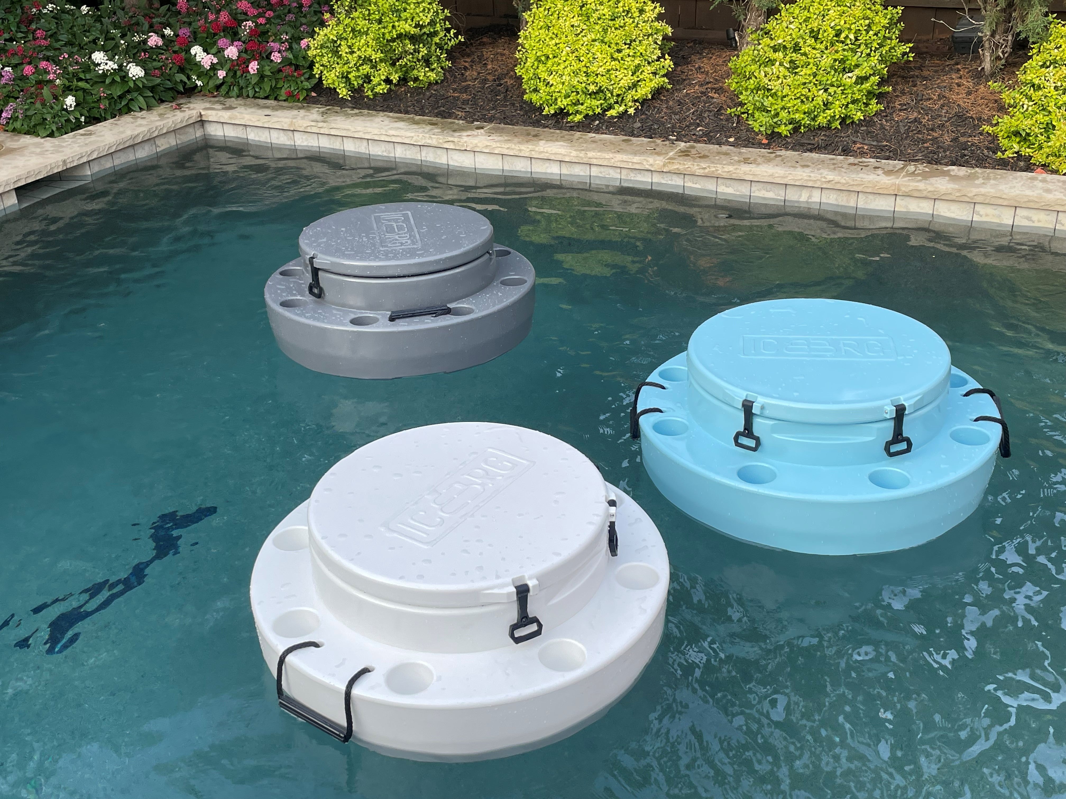 three ICEBRG floating coolers floating in pool